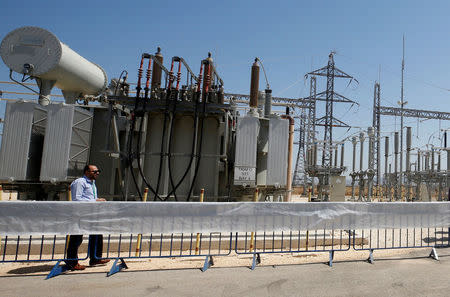 A worker walks in the new electrical substation near the West Bank city of Jenin July 10, 2017. REUTERS/Abed Omar Qusini