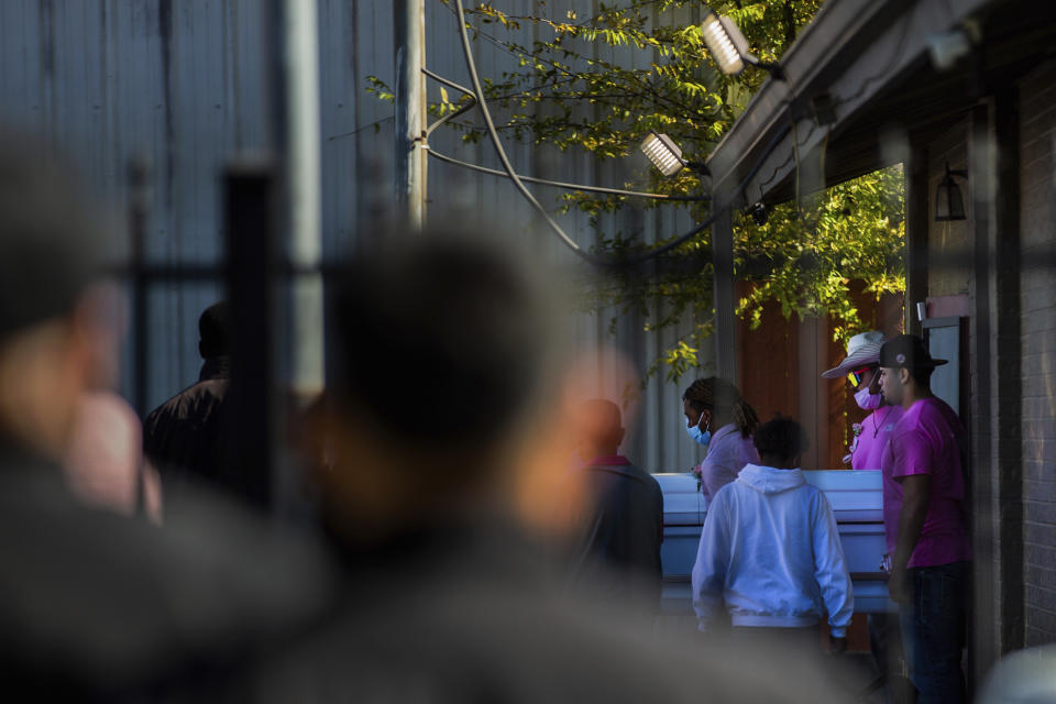 People transfer the casket of Brianna Rodriguez from La Paz Memorial Funeral Home to a hearse, Saturday, Nov. 13, 2021, in Houston. Rodriguez died from injuries sustained during a stampede at the Astroworld music festival. (Marie D. De Jesús/Houston Chronicle via AP)