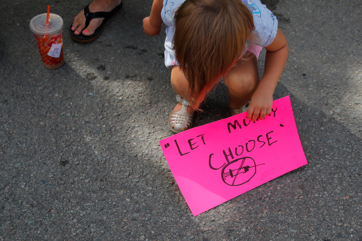 Three year-old Violet Daniels and her family take part in a 