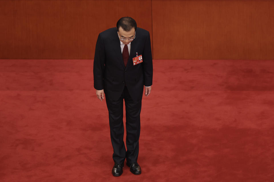 BEIJING, CHINA - MARCH 05: China's Premier Li Keqiang bows to delegates after delivering his work report during the opening of the first session of the 14th National People's Congress at The Great Hall of People on March 5, 2023 in Beijing, China.China's annual political gathering known as the Two Sessions will convene leaders and lawmakers to set the government's agenda for domestic economic and social development for the year. (Photo by Lintao Zhang/Getty Images)