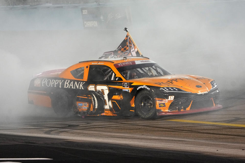 Daniel Hemric celebrates after winning the NASCAR Xfinity Series auto race Saturday, Nov. 6, 2021, in Avondale, Ariz. Hemric won the season title. (AP Photo/Rick Scuteri)