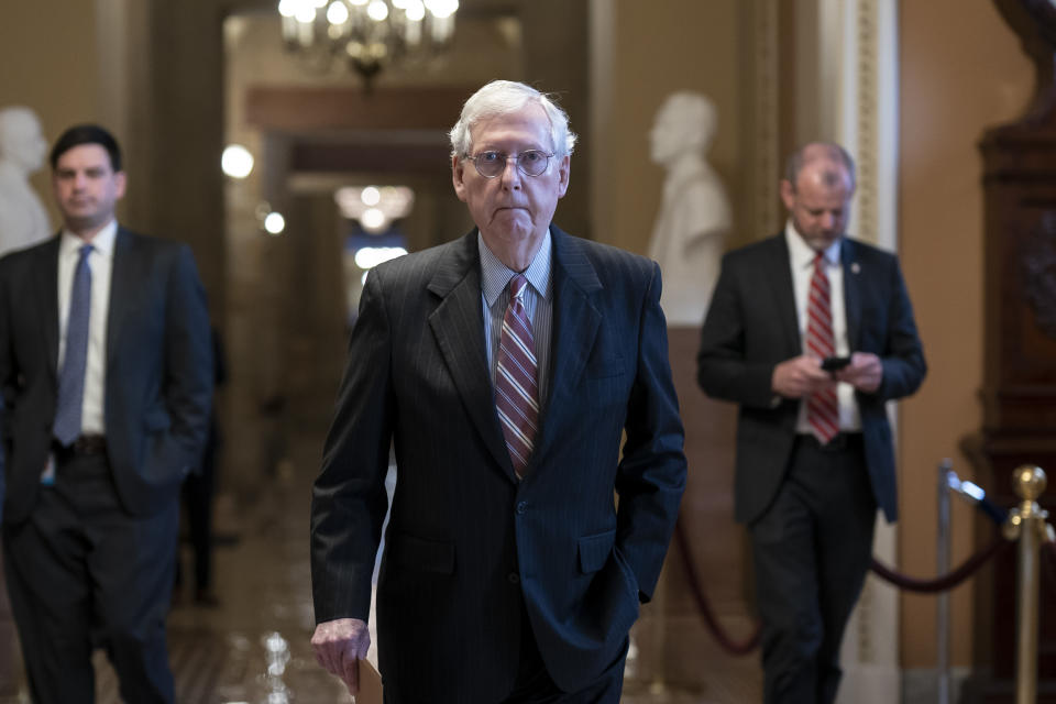 FILE - Senate Minority Leader Mitch McConnell, R-Ky., walks to the chamber on the morning after an 18-year-old gunman opened fire at a Texas elementary school, killing at least 19 children, at the Capitol in Washington, Wednesday, May 25, 2022. McConnell has been released from the hospital after treatment for a concussion and will continue to recover in an inpatient rehabilitation facility. (AP Photo/J. Scott Applewhite, File)