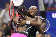 Sloane Stephens, of the United States, right, hugs Coco Gauff, of the United States, after Stephens won their match during the second round of the US Open tennis championships, Wednesday, Sept. 1, 2021, in New York. (AP Photo/John Minchillo)