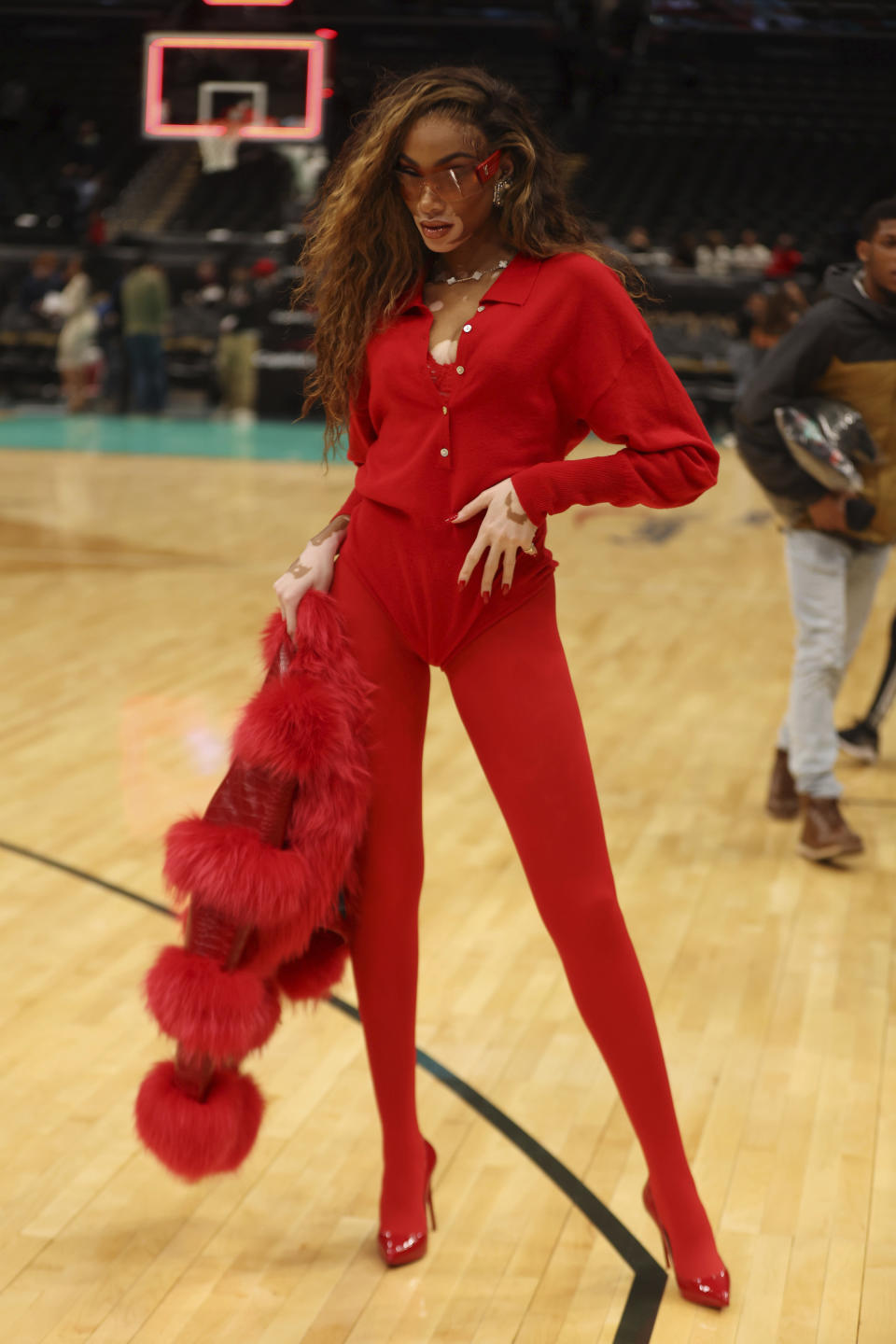 Harlow rocked a festive, all-red look while attending the Washington Wizards vs. Orlando Magic game on Dec. 26. (Photo via mpi34/MediaPunch/IPX)
