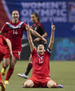 VANCOUVER, CANADA - JANUARY 27: Christine Sinclair #12 of Canada celebrates with teammates Melissa Tancredi #14 at the final whistle after defeating Mexico 3-1 in the semifinals of the 2012 CONCACAF WomenÕs Olympic Qualifying Tournament at BC Place on January 27, 2012 in Vancouver, British Columbia, Canada. Canada qualifies for the 2012 Summer Olympic Games with the win. (Photo by Rich Lam/Getty Images)