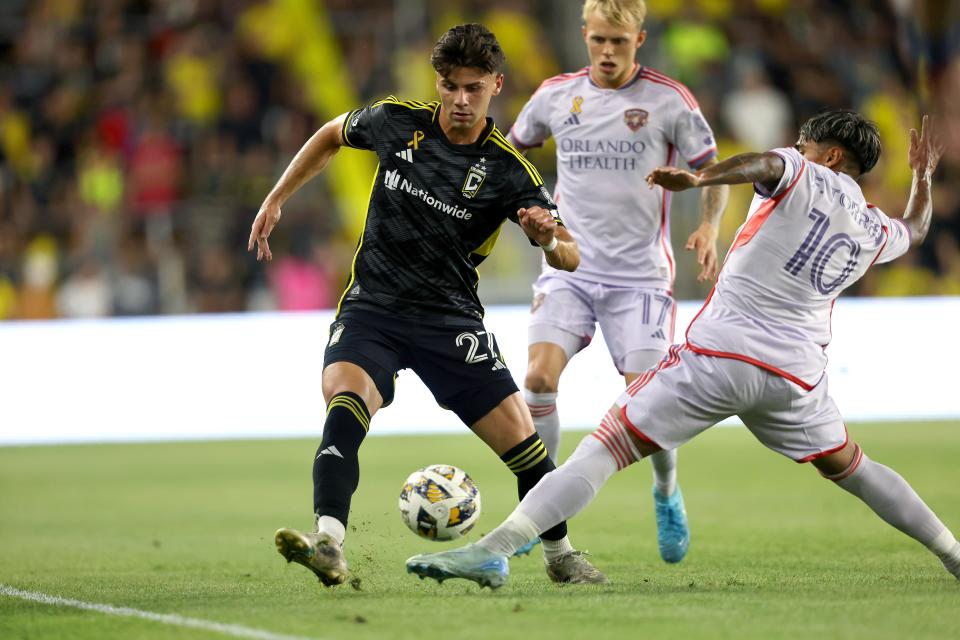 Sep 21, 2024; Columbus, Ohio, USA; Columbus Crew forward Max Arfsten (27) dribbles the ball as Orlando City forward Facundo Torres (10) defends during the first half at Lower.com Field. Mandatory Credit: Joseph Maiorana-Imagn Images