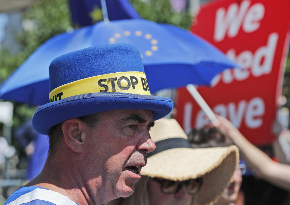 An anti-Brexit protestor shouts outside the venue where the announcement of the new leader of the Conservative Party will be made in London, Tuesday, July 23, 2019. Brexit champion Boris Johnson was announced Tuesday as winner in the contest to lead Britain’s governing Conservative Party, and to become the country’s next prime minister. (AP Photo/Frank Augstein)