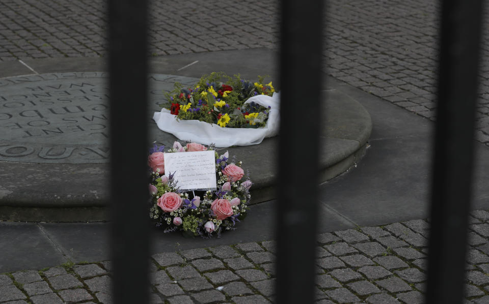 Wreaths for the Westminster terrorist attack are seen placed in the courtyard of Westminster Abbey that is closed due to the coronavirus in London, Sunday, March 22, 2020. On 22 March 22, 2017, a terrorist attack took place outside the Palace of Westminster in London. For some people the coronavirus causes mild or moderate symptoms, such as fever and cough, but for some it can cause more severe illness, including pneumonia. (AP Photo/Kirsty Wigglesworth)