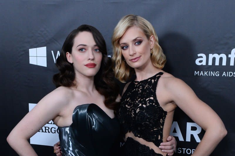 Kat Dennings (L) and Beth Behrs attend the amfAR Inspiration Gala in 2014. File Photo by Jim Ruymen/UPI