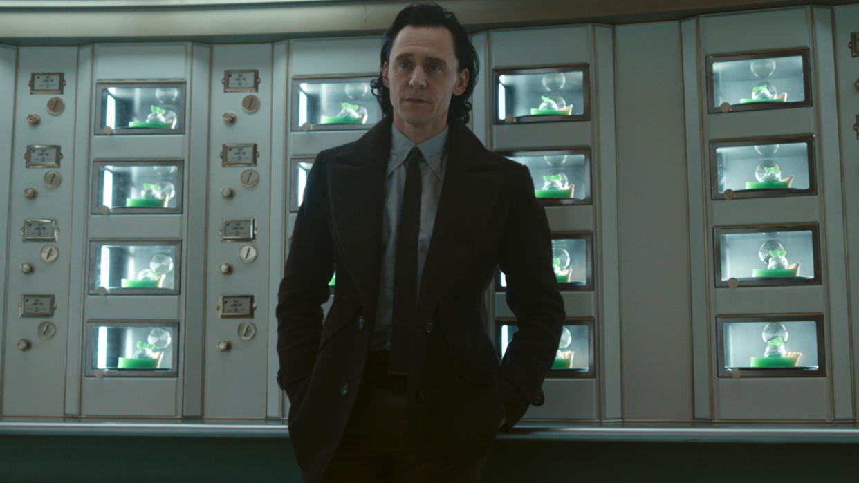  Tom Hiddleston standing in the TVA automat, looking rather upset, in Loki Season 2. 