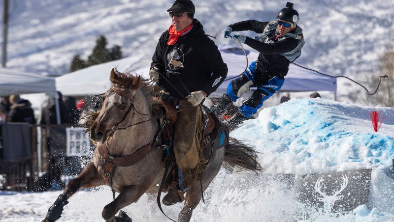 Patrick Smith pulls Bryan Coll during the 2024 Utah Skijoring competition at the Wasatch County Event Complex in Heber City on Saturday, Feb. 17, 2024.