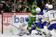 Buffalo Sabres goaltender Ukko-Pekka Luukkonen (1) watches as the puck gets past him on a goal as Minnesota Wild left wing Jordan Greenway, second from left, and Sabres defenseman Ilya Lyubushkin (46) look on in the second period of an NHL hockey game Saturday, Jan. 28, 2023, in St. Paul, Minn. (AP Photo/Andy Clayton-King)