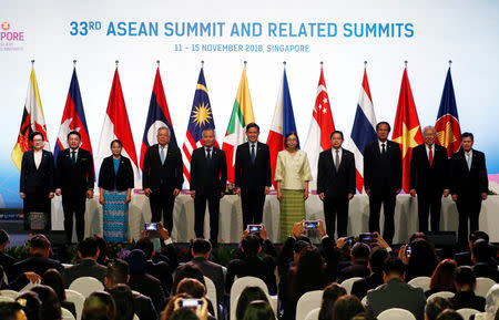 ASEAN trade ministers and representatives pose for a group photo at the ASEAN Summit in Singapore November 12, 2018. REUTERS/Edgar Su