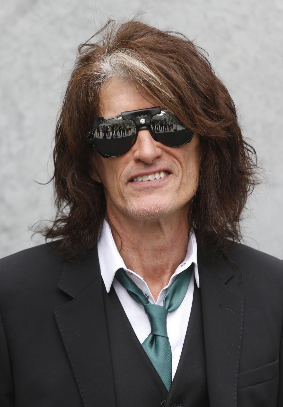 US guitarist Joe Perry attends the Emporio Armani men's Spring-Summer 2015 show, part of the Milan Fashion Week, unveiled in Milan, Italy, Monday, June 23, 2014. Perry is participating along with Dr. Anthony Fauci, soprano Renee Fleming, the CEO's of Moderna and Pfizer among others in a unique three-day Vatican conference starting Thursday, May 6, 2021, on COVID-19, other global health threats and how science, solidarity and spirituality can address them. (AP Photo/Luca Bruno)