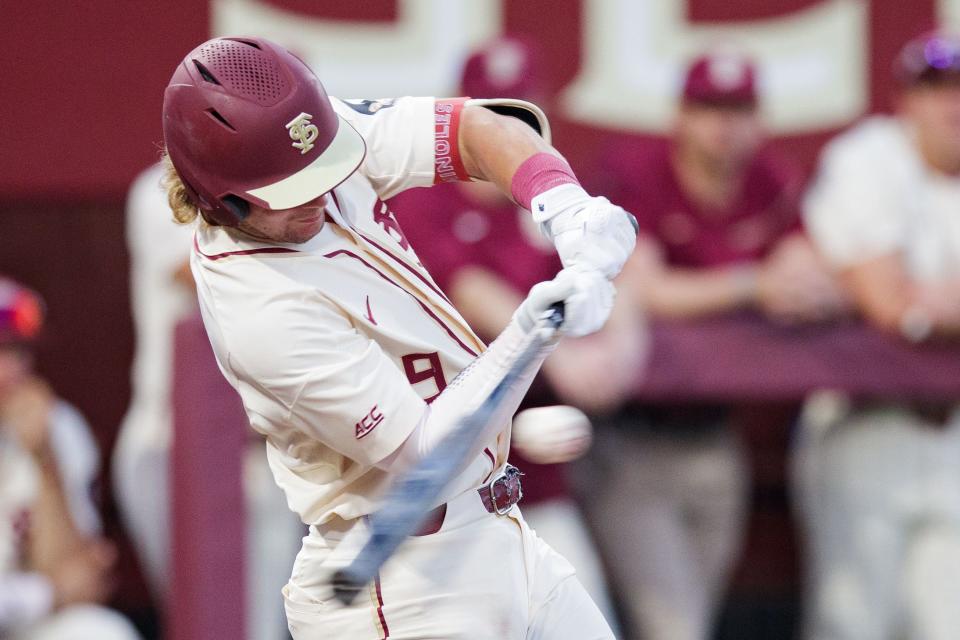 Florida State infielder Treyton Rank (9) makes contact on his swing. The Florida State Seminoles defeated the Samford Bulldogs 7-0 on Friday, Feb. 25, 2022.