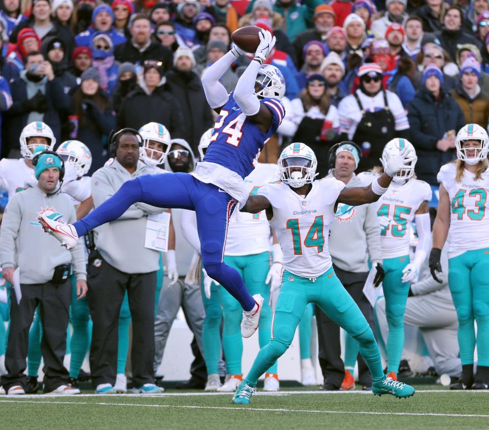 Bills cornerback Kaiir Elam made this critical interception last year in the playoff victory over Miami. The intended receiver, Trent Sherfield, is now his Bills teammate.