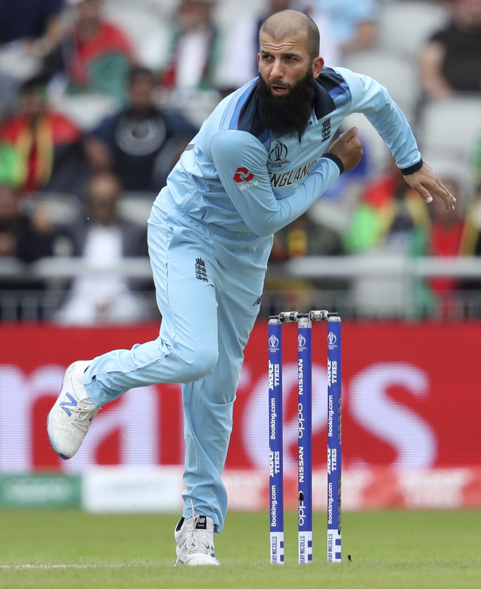England's Moeen Ali bowls during the Cricket World Cup match between England and Afghanistan at Old Trafford in Manchester, England, Tuesday, June 18, 2019. (AP Photo/Rui Vieira)