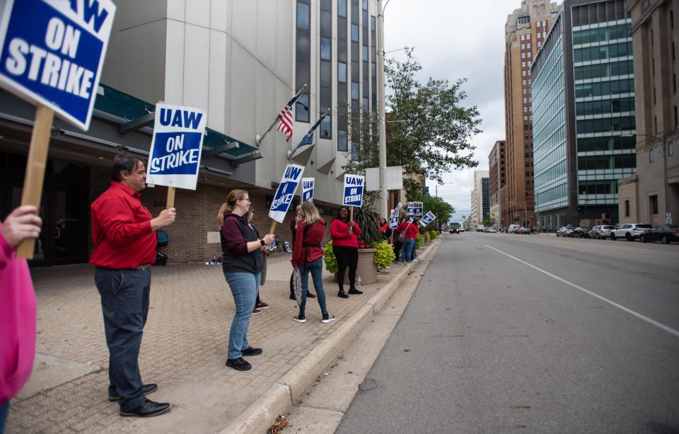 UAW Local 2256 members picket in front of the Blue Cross Blue Shield of Michigan Lansing office, Wednesday, Sept. 13, 2023.