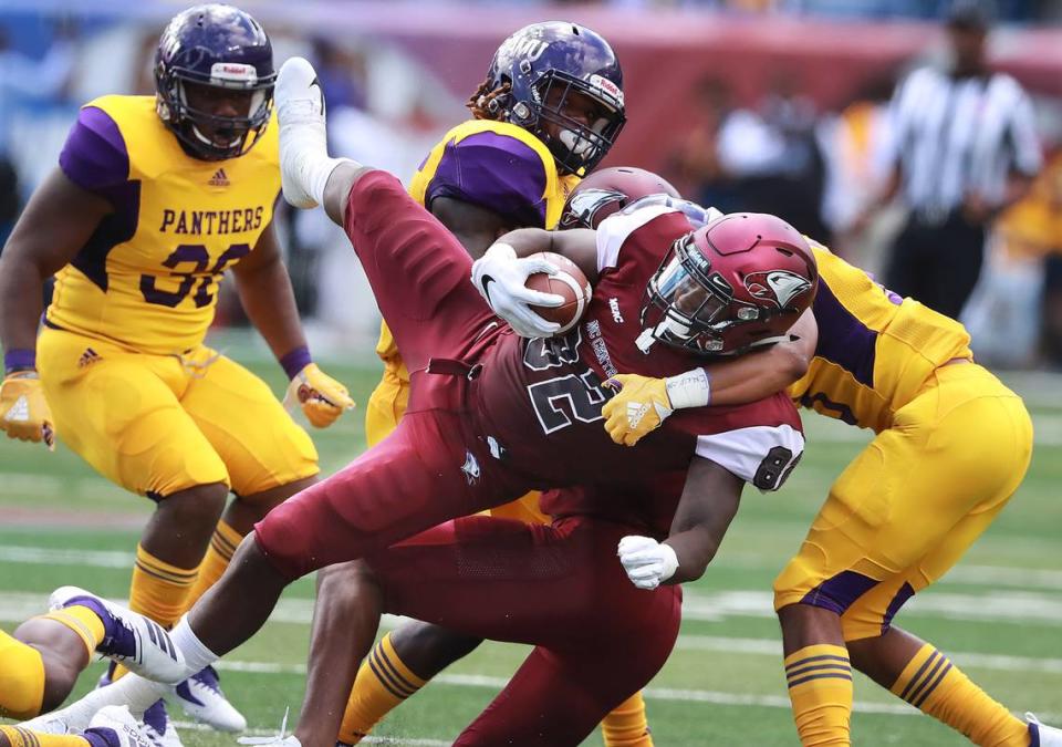 North Carolina Central tight end Josh McCoy is upended by Prairie View A&M defenders during the first quarter of the MEAC-SWAC Challenge college football game on Sunday, Sept. 2, 2018, in Atlanta, Ga. (Photo by Curtis Compton/Atlanta Journal-Constitution/TNS/Sipa USA)