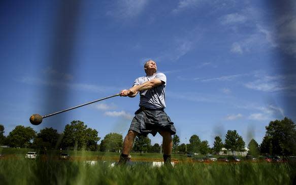 Chris Nickell hurls a 16-pound hammer during the athletic portion of the Springfield Area Highland Games and Celtic Festival in Chatham Community Park on July 23, 2016.