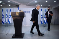 REPLACES COMMON GOOD INSTEAD OF COMMON GROUND - Israeli opposition leader Yair Lapid, leaves the podium at the end of a news conference in Tel Aviv, Thursday, May. 6, 2021. Lapid called on his potential partners to find "common good" and expressed optimism that a new coalition government would be formed. (AP Photo/Oded Balilty)