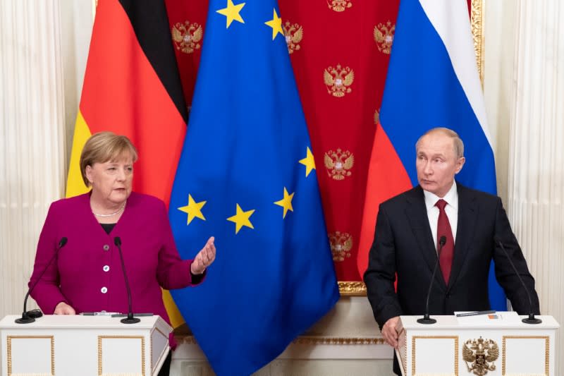 Russian President Putin and German Chancellor Merkel hold a joint news conference in Moscow