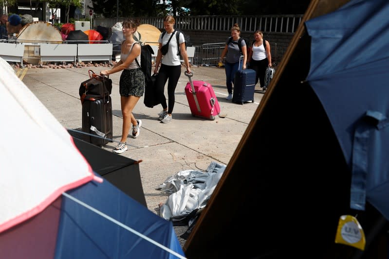 Students from Sweden and Norway leave the campus of Hong Kong Baptist University, Hong Kong