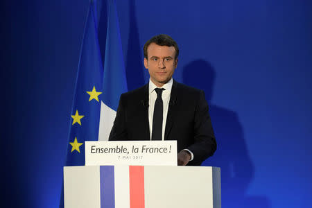 French President-elect Emmanuel Macron delivers a speech at his campaign headquarters after early results in the second round in the 2017 French presidential election in Paris, France, May 7, 2017. REUTERS/Lionel Bonaventure/Pool