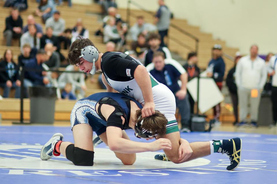 Saugerties' Isaiah Hockx, left, wrestles Minisink Valley's P.J. Duke, top, in the Section 9 Div. I championships in Central Valley, NY on February 10, 2024. ALLYSE PULLIAM/For the Times Herald-Record