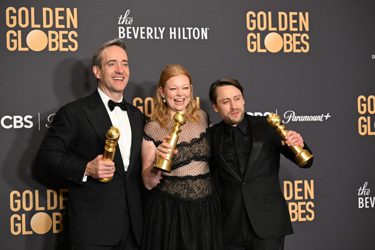 Succession stars Matthew Macfayden, Sarah Snook and Kieran Culkin pose with their Golden Globes.