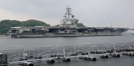 USS Ronald Reagan, a Nimitz-class nuclear-powered supercarrier, leaves from its home port to be deployed in waters near Japan, in Yokosuka, south of Tokyo, Japan, in this photo taken by Kyodo May 16, 2017. Mandatory credit Kyodo/via REUTERS