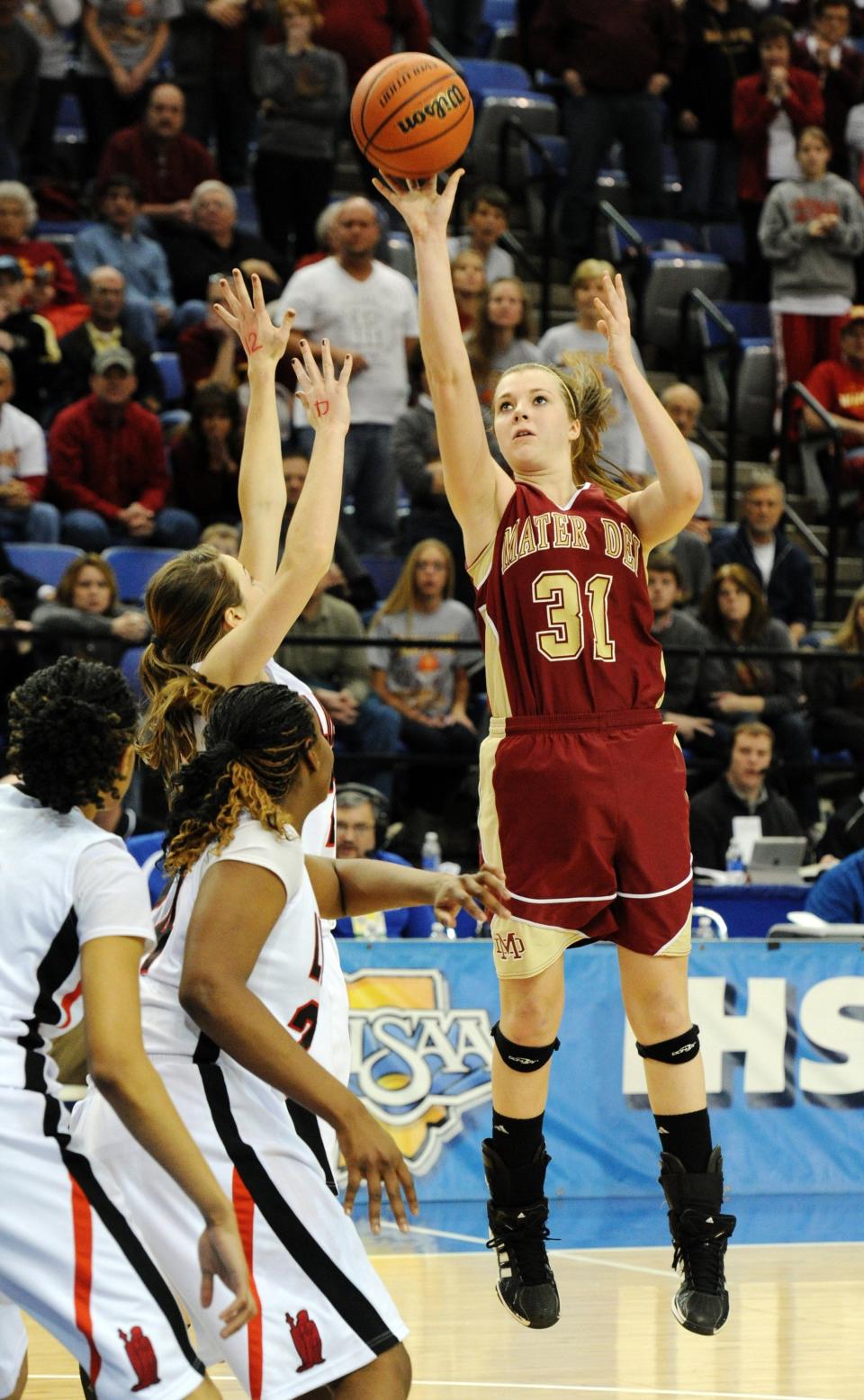 Mater Dei's Maura Muensterman puts up the game winning shot in overtime against Fort Wayne Bishop Luer in the 2A girls' state championship basketball game at the Hulman Center in Terre Haute, Ind., on Saturday, March 3, 2012
