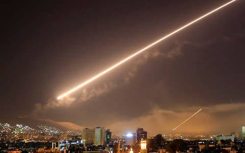 Damascus skies erupt with surface to air missile fire - Credit: AP