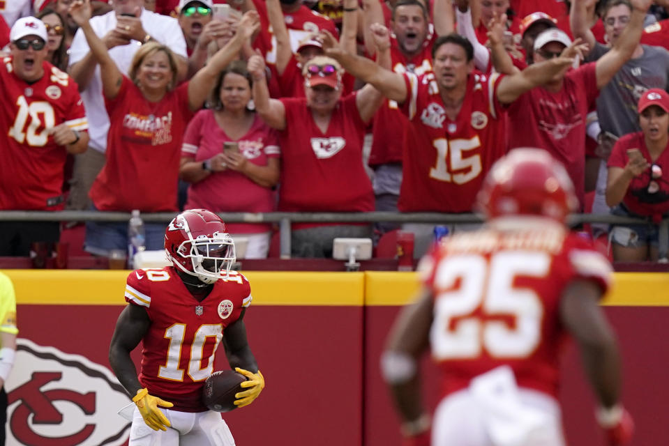 Kansas City Chiefs wide receiver Tyreek Hill (10) celebrates after catching a 75-yard pass for a touchdown during the second half of an NFL football game against the Cleveland Browns Sunday, Sept. 12, 2021, in Kansas City, Mo. (AP Photo/Charlie Riedel)