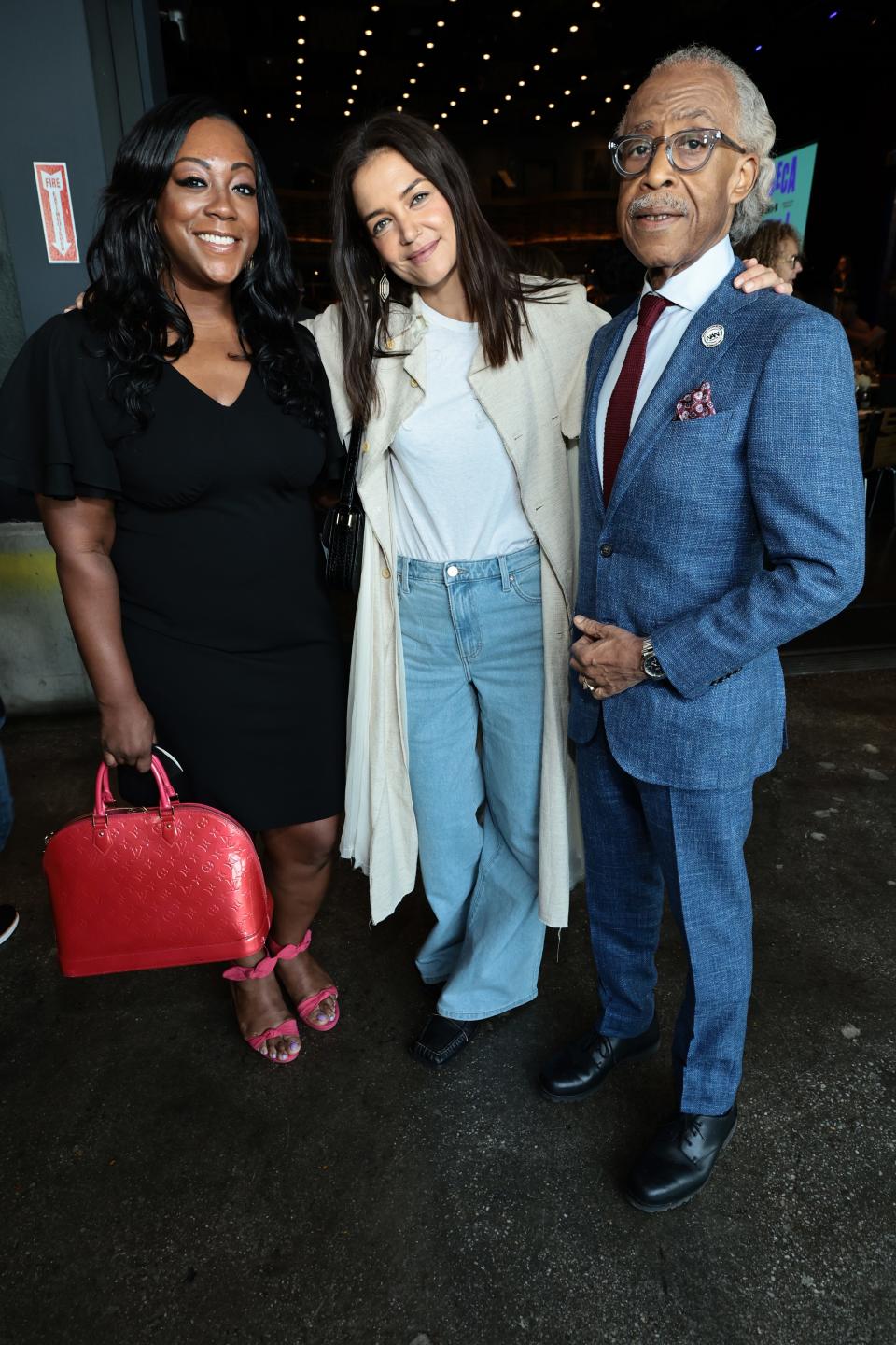 Dominique Sharpton, a contestant on ABC's new summer game show "Claim to Fame," photographed with Katie Holmes and Reverend Al Sharpton at the Tribeca Film Festival on June 8, 2022 in New York City.