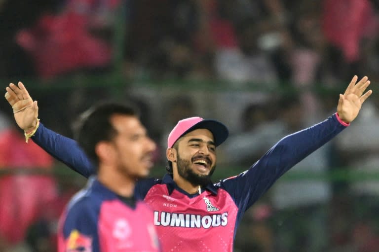 Star man: Rajasthan Royals' Riyan Parag (R) and Yuzvendra Chahal celebrate the dismissal of Delhi Capitals' captain Rishabh Pant (Sajjad HUSSAIN)