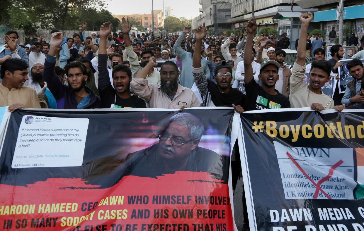 Angry Islamists chant slogans during a demonstration against the Pakistani newspaper Dawn, outside the Press Club in Karachi on Tuesday: AP