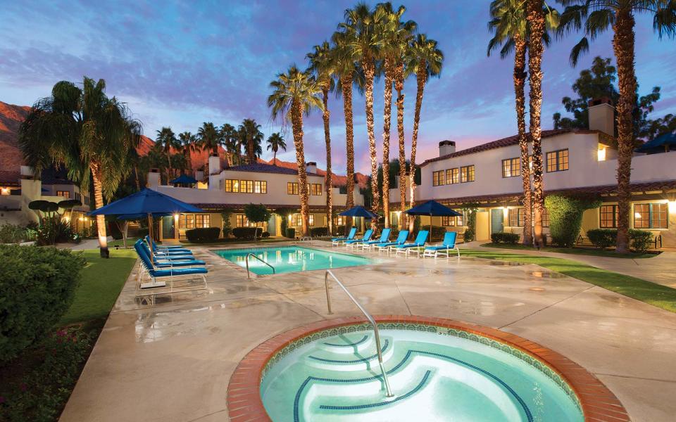 <p>The iconic resort on the outskirts of Palm Springs is celebrating 90 years of hosting families, friends, and the Hollywood elite who return to <a rel="nofollow noopener" href="http://laquintaresort.com/" target="_blank" data-ylk="slk:La Quinta;elm:context_link;itc:0;sec:content-canvas" class="link ">La Quinta</a> year after year. Set on 45 acres of perfectly manicured gardens and towering palm trees, the resort is outlined by the Palm Desert in the distance. The hotel is made up Spanish-style casitas and whole homes that can host entire families. As far as activities are concerned, the numbers speak for themselves: La Quinta has 41 swimming pools, 23 tennis courts with both hard and clay surfaces, five golf courses, and a 23,000-square foot spa.</p>