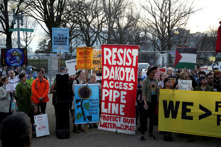 People protest against U.S. President Donald Trump's directive to permit the Dakota Access Pipeline during a demonstration at the White House in Washington, U.S., February 8, 2017. REUTERS/Joshua Roberts