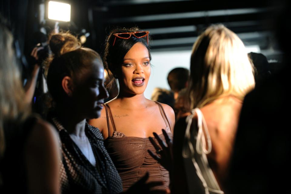 Rihanna talks to media backstage after Savage x Fenty fashions are shown at the Brooklyn Navy Yard at the end of Fashion Week in 2018, the year she launched the lingerie line.