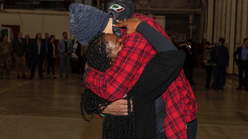 Brittney Griner embraces her wife, Cherelle Griner, after her release in a prisoner swap with Russia, Dec. 9, 2022.  / Credit: Miquel A. Negron/U.S. Army via AP