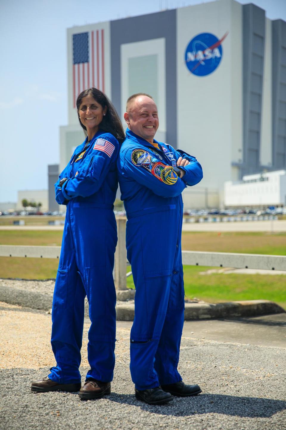 NASA astronauts Suni Williams, left, and Mike Fincke, right, pose for photographs while visiting NASA’s Kennedy Space Center in Florida, May 18, 2022, in advance of the agency’s Boeing Orbital Flight Test-2 (OFT-2) for NASA’s Commercial Crew Program.