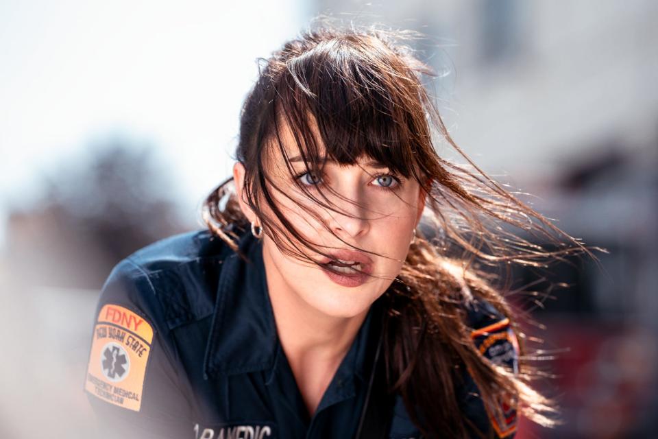 Dakota Johnson in a paramedic uniform