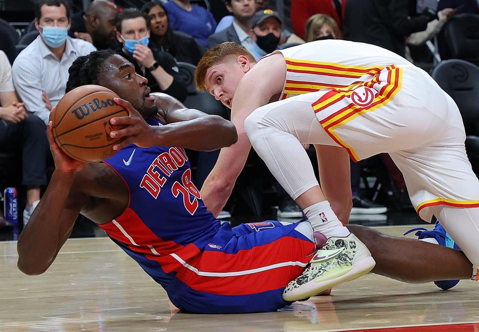Hawks forward Kevin Huerter defends against Pistons center Isaiah Stewart during the first half on Monday, Oct. 25, 2021, in Atlanta.