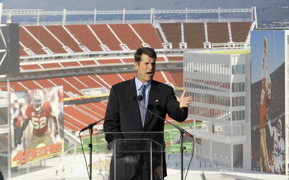 San Francisco 49ers head coach Jim Harbaugh speaks at a groundbreaking ceremony at the construction site for the 49ers' new NFL football stadium in Santa Clara, Calif., Thursday, April 19, 2012. (AP Photo/Jeff Chiu)