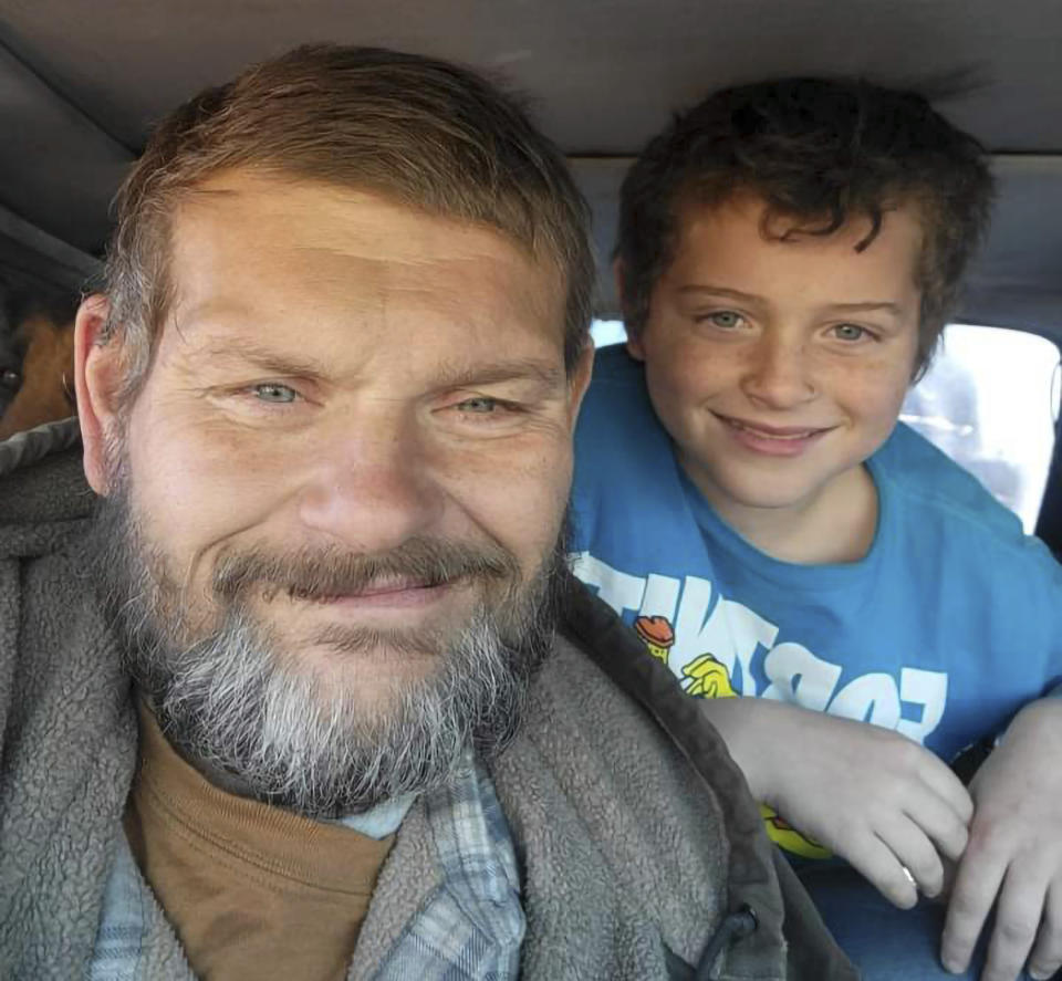 This 2022 photo provided by Richard Blodgett shows Blodgett and his son, Jakob. Blodgett was arrested in December, and Jakob was placed in a foster home under the Arizona Department of Child Safety where he developed complications from diabetes and died. (Richard Blodgett via AP)