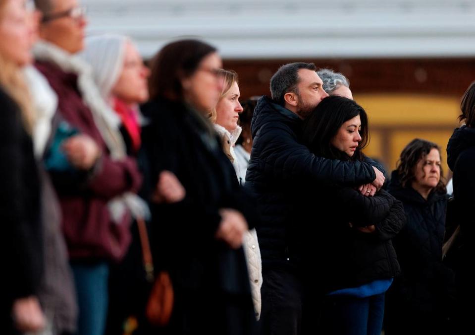 People listen during a vigil held outside the Apex Town Hall on Monday, Jan. 29, 2024, to honor Nancy Taylor and Gabrielle Raymond, who were shot and killed in an Apex neighborhood on Jan. 15.