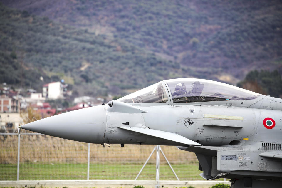 An Italian Eurofighter lands at an airbase during an inauguration ceremony at an airbase in Kocuve, about 85 kilometers (52 miles) south of Tirana, Albania, Monday, March 4, 2024. NATO member Albania inaugurated an international tactic air base on Monday, the Alliance's first one in the Western Balkan region. (AP Photo/Armando Babani)