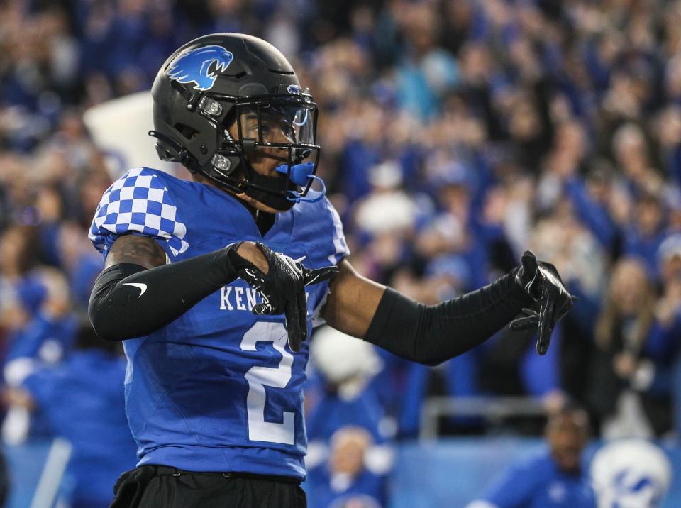 Kentucky wide receiver Barion Brown (2) throws down the Ls after scoring a touchdown against Louisville in the third quarter. The Wildcats beat the No. 25 Cards 26-13 in Saturday's Battle of the Bluegrass college football game. Nov. 26, 2022.  