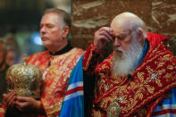 Patriarch Filaret, head of the Ukrainian Orthodox Church of the Kiev Patriarchate, prays as he conducts a service at the Volodymysky Cathedral in Kiev, Ukraine October 11, 2018. REUTERS/Valentyn Ogirenko